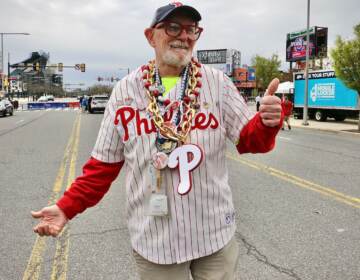 Steve Wilson gives a thumbs up as he poses, decked out in Phillies gear.