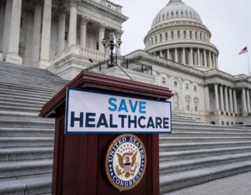 Save Healthcare sign outside U.S. Capitol