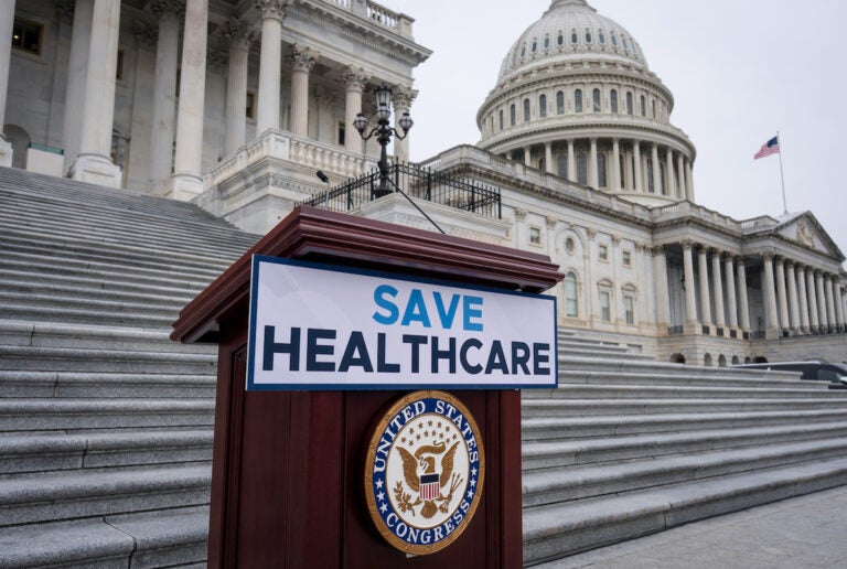 Save Healthcare sign outside U.S. Capitol