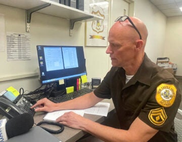 A police officer working at his desk