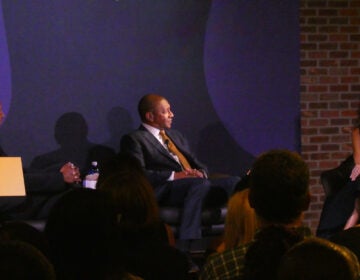 Bryan and Howard Stevenson and moderator Dr. Robin Smith discuss unity on stage