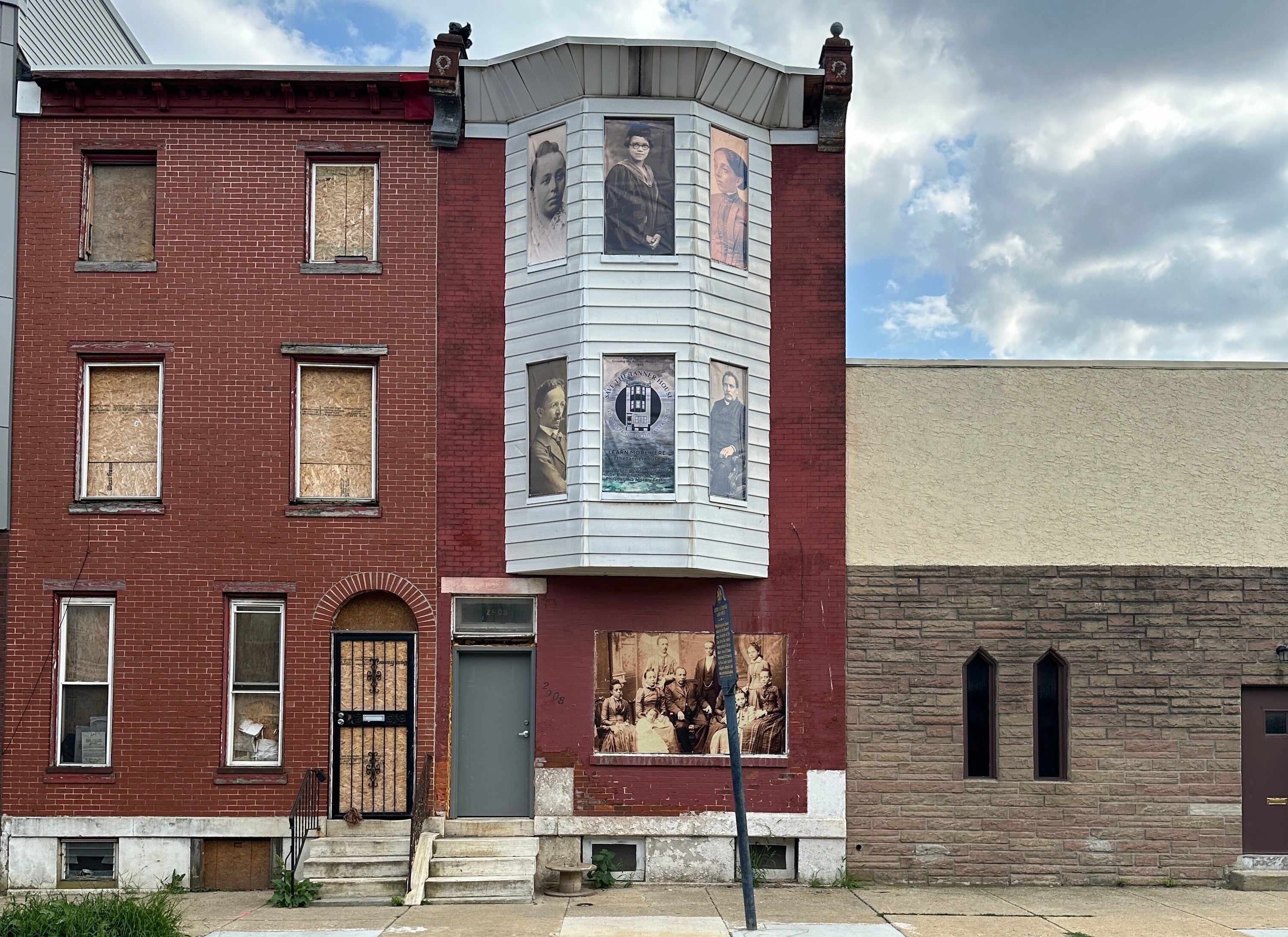 The windows of the Tanner House with pictures on them