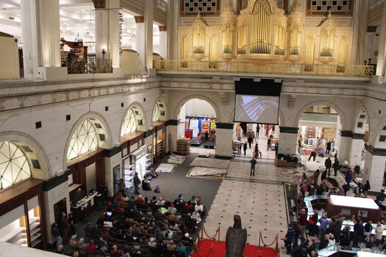 A large crowd is gathered to listen to an organ concert in Philadelphia