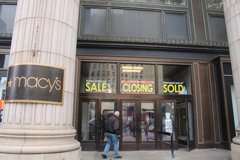 Signs show that the Center City Macy's is closed after being sold