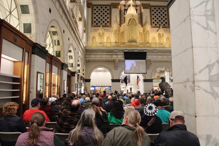 A large crowd is gathered to listen to an organ concert in Philadelphia