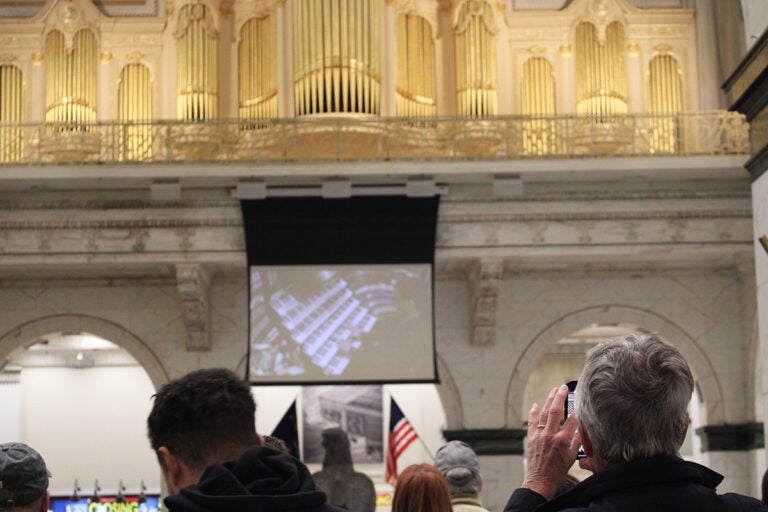 A large crowd is gathered to listen to an organ concert in Philadelphia