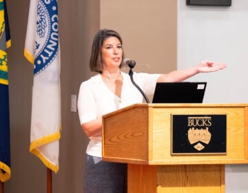 Tracy Timby, vice president of workforce and strategic partnerships at Bucks County Community College, speaks at a podium